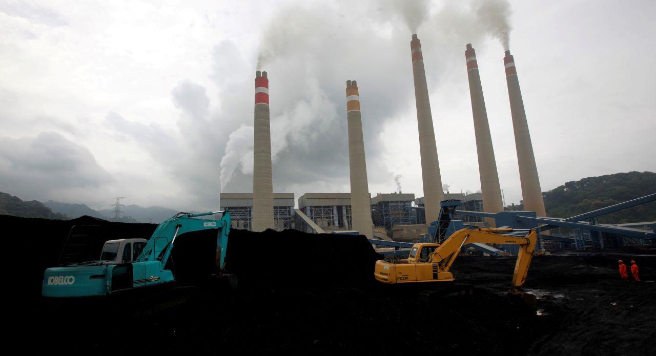 Excavators pile coal in a storage area in an Indonesian power plant in Suralaya, in Banten province in this file photo on Jan 20, 2010. Photo: Reuters