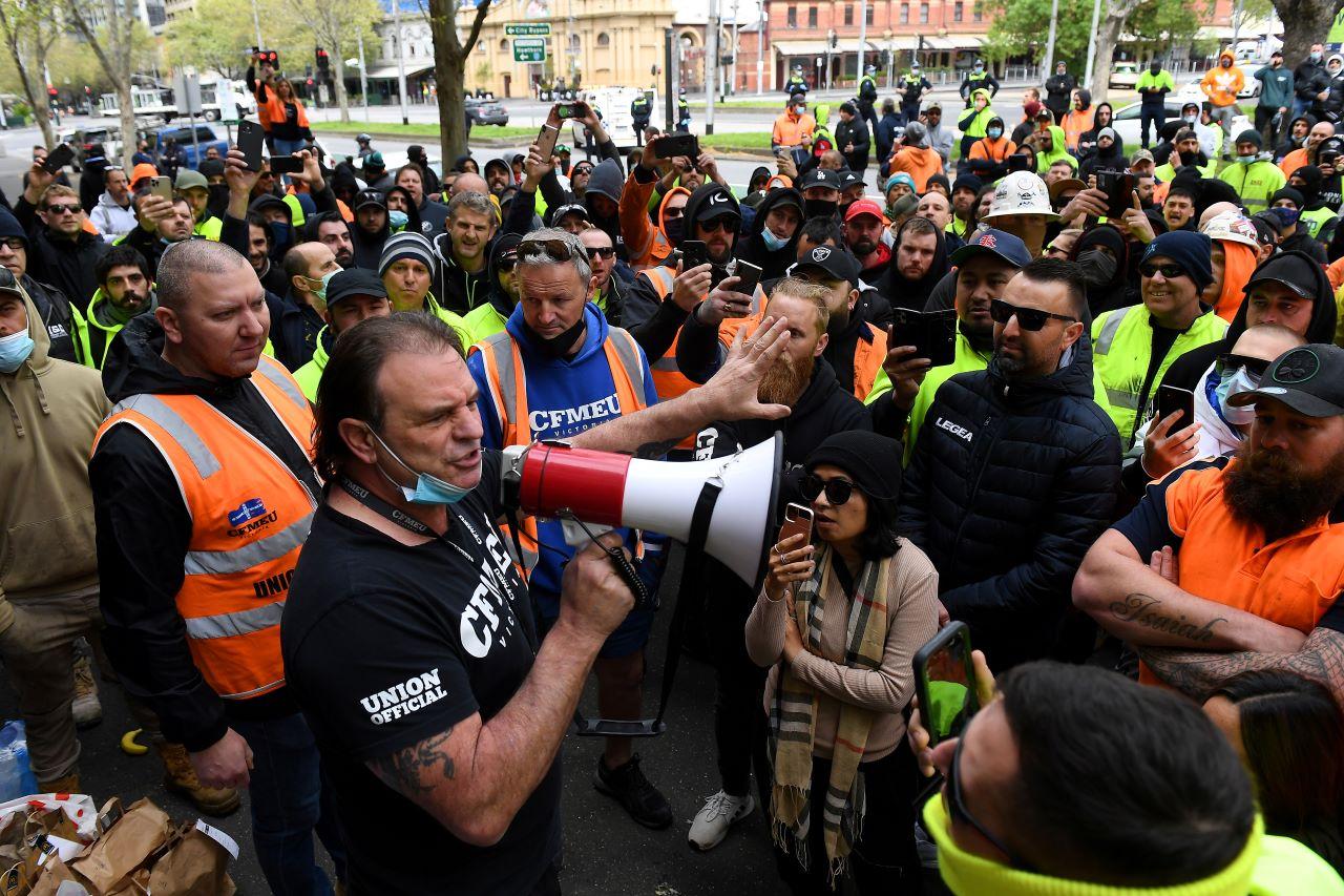 A unionist addresses construction workers protesting work-related Covid-19 restrictions at Construction, Forestry, Maritime, Mining and Energy Union headquarters in Melbourne, Australia, Sept 20. Photo: Reuters
