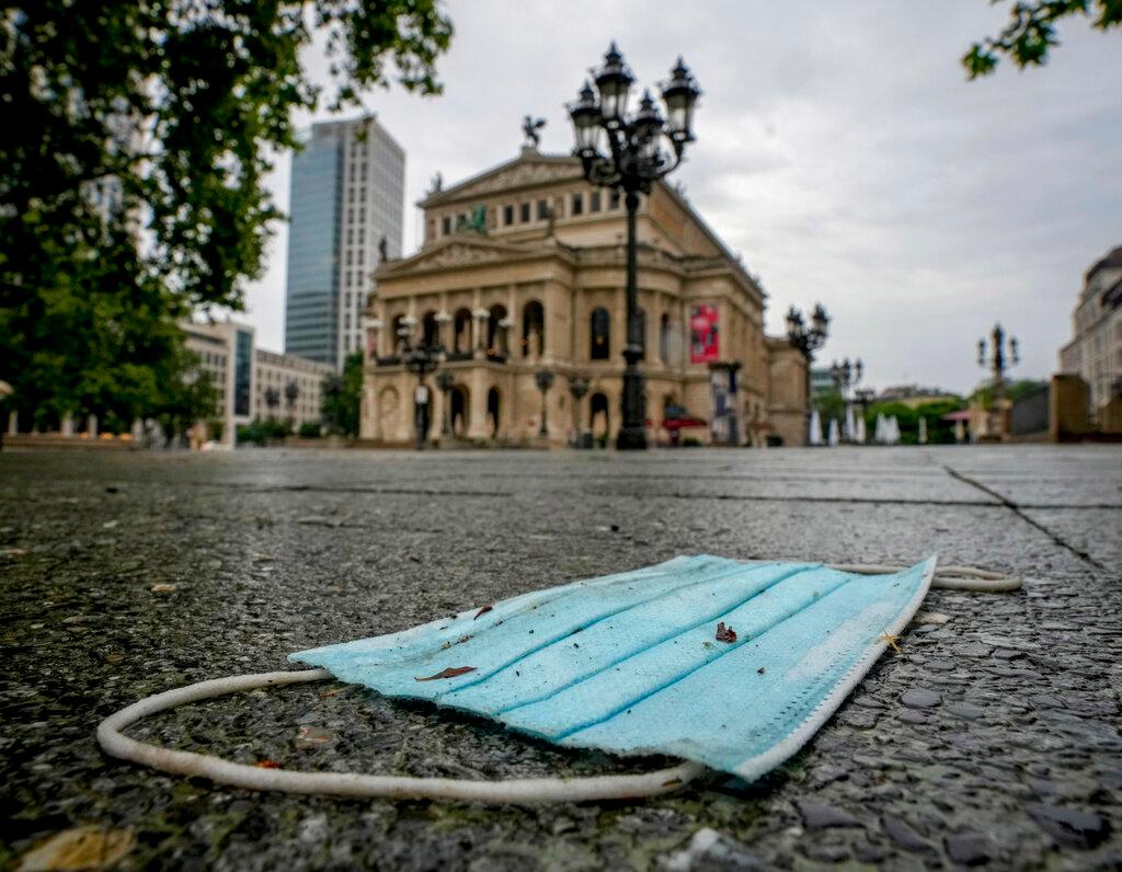 A face mask sits discarded in Frankfurt, Germany, in this July 13 file photo. Photo: AP