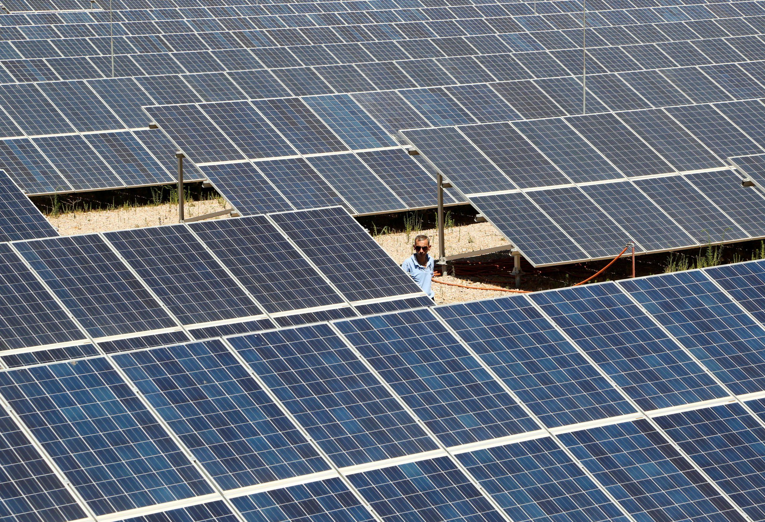 A worker walks past solar panels at a photovoltaic power plant in Kiswah, Syria, in this Sept 8 file photo. Malaysia, Vietnam and Thailand account for 80% of all panel imports into the US. Photo: Reuters