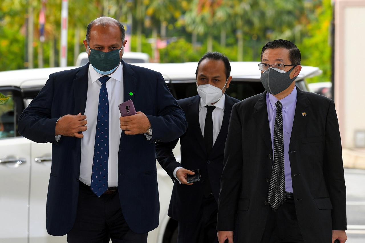 Former Penang chief minister Lim Guan Eng and his lawyer Gobind Singh Deo (left) arrive at the Kuala Lumpur court complex today. Photo: Bernama