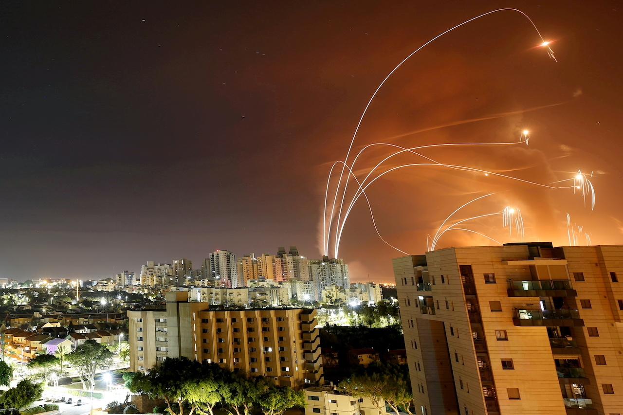 Streaks of light are seen as Israel's Iron Dome anti-missile system intercepts rockets launched from the Gaza Strip towards Israel, as seen from Ashkelon, Israel, May 12. Photo: Reuters