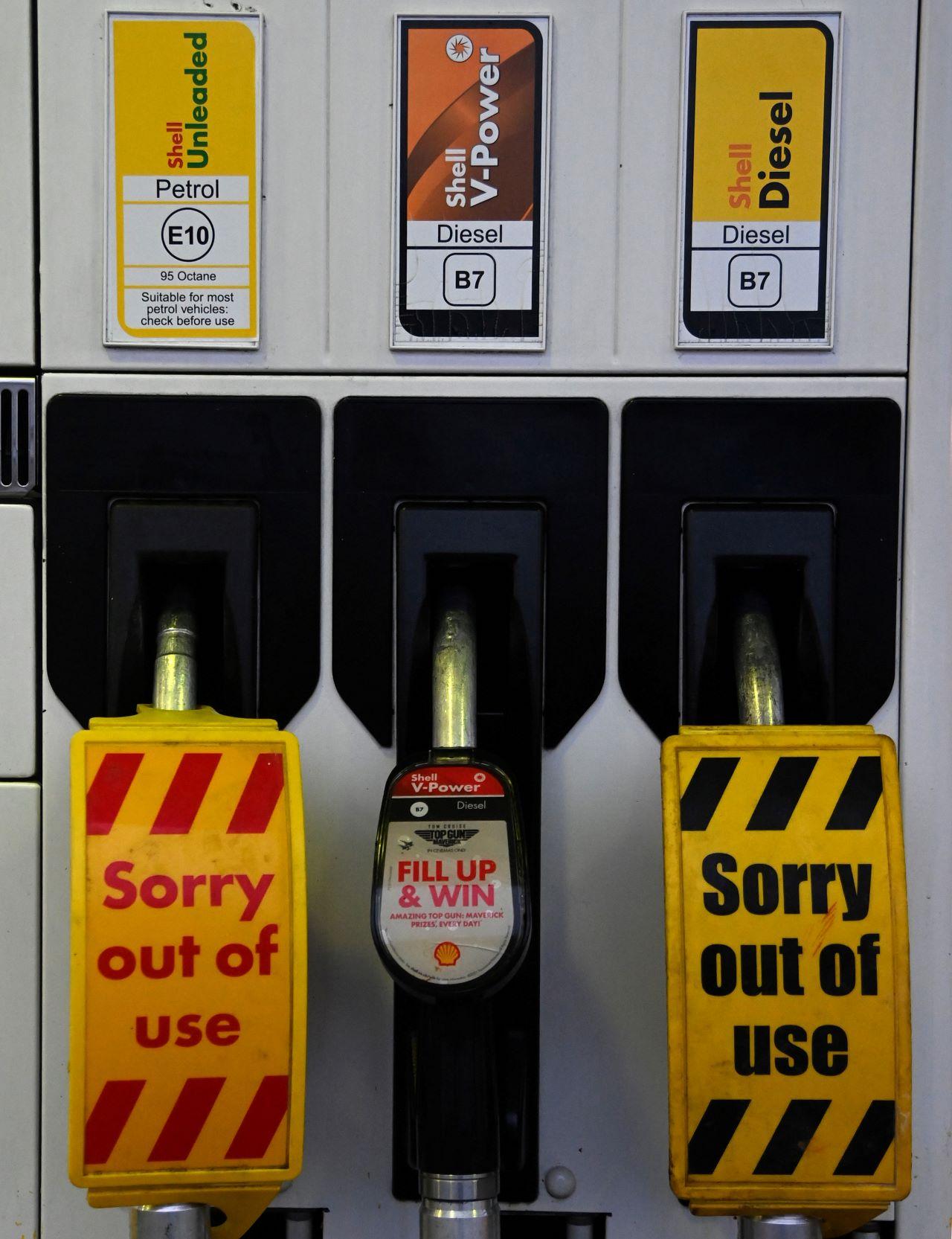 Out of use signs are placed over pumps at a Shell petrol station in London, Britain, Sept 24. Photo: Reuters