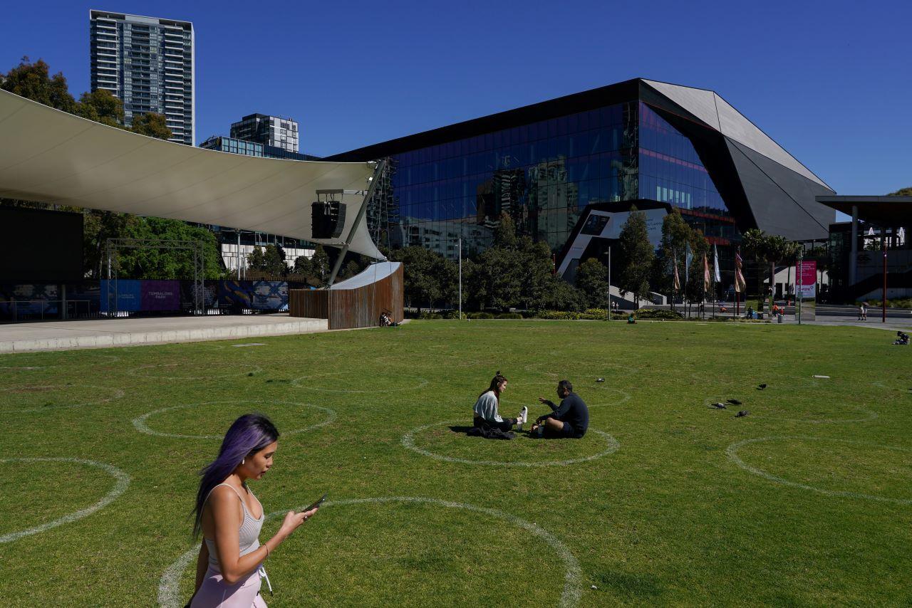 People sit inside a social distancing circle at a city park as some restrictions are eased for fully vaccinated residents during a lockdown to curb the spread of the Covid-19 outbreak in Sydney, Australia, Sept 22. Photo: Reuters