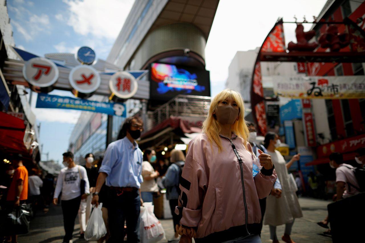 Shoppers walk at the Ameyoko shopping district, also called Ameya-Yokocho, where Tokyo’s biggest street food market is located, in Tokyo, Japan in this file photo dated June 5. Photo: Reuters