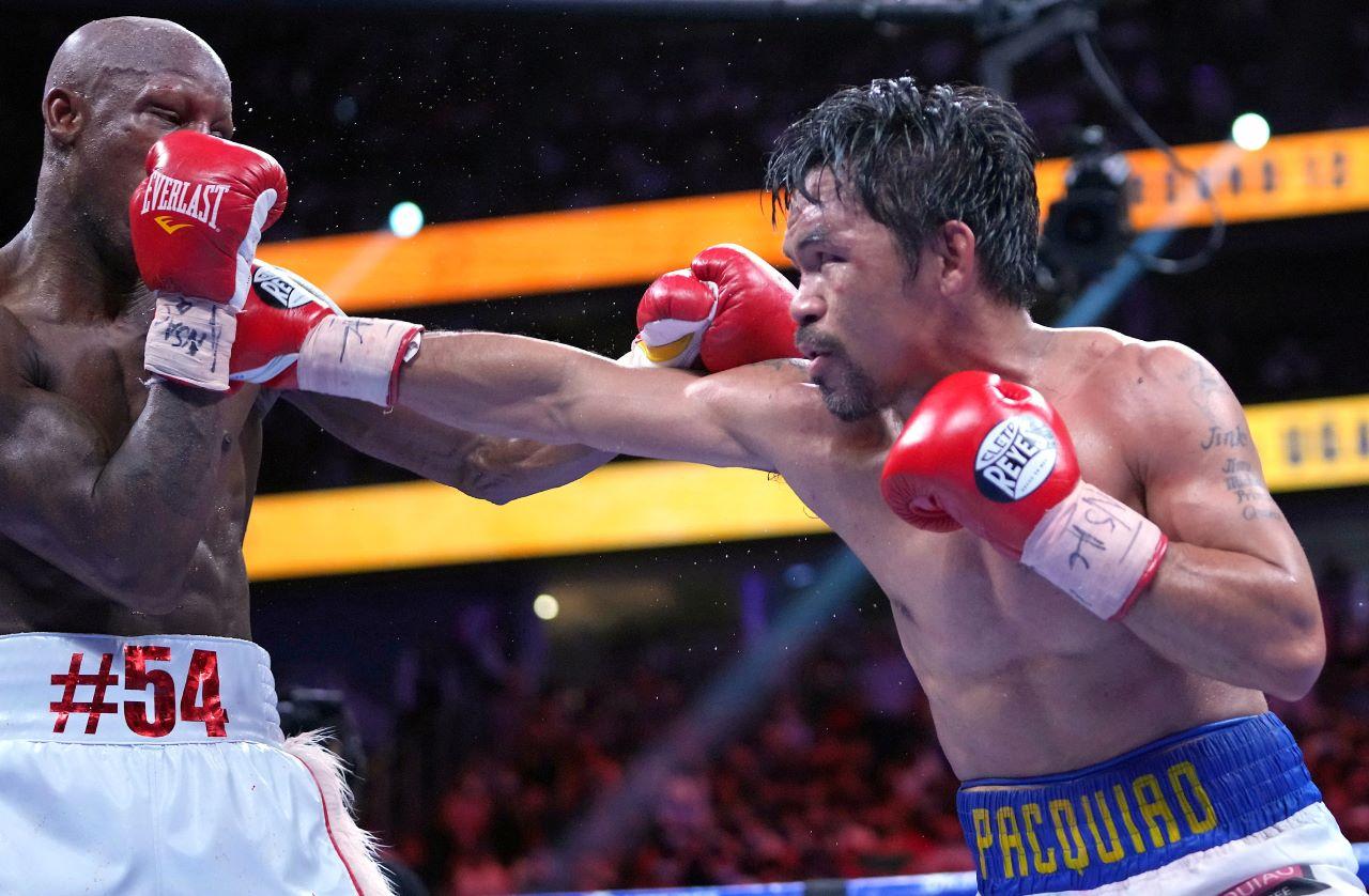 Manny Pacquiao (right) fights Yordenis Ugasin a world welterweight championship bout at T-Mobile Arena in Las Vegas in this file photo. Photo: Reuters