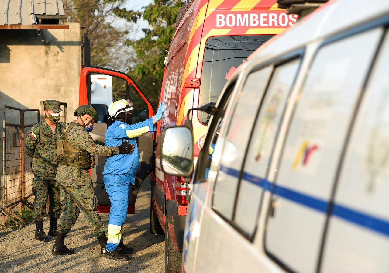 Army soldiers check an ambulance driver at the Penitenciaria del Litoral jail after prisoners died and others were injured in a riot in Guayaquil, Ecuador, Sept 28. Photo: Reuters