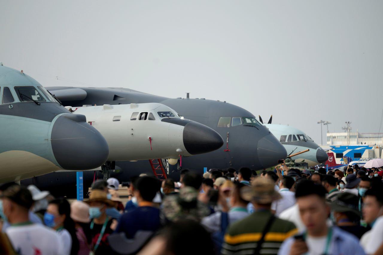 Visitors walk past military aircraft displayed at the China International Aviation and Aerospace Exhibition, or Airshow China, in Zhuhai, Guangdong province, China Sept 29. Photo: Reuters