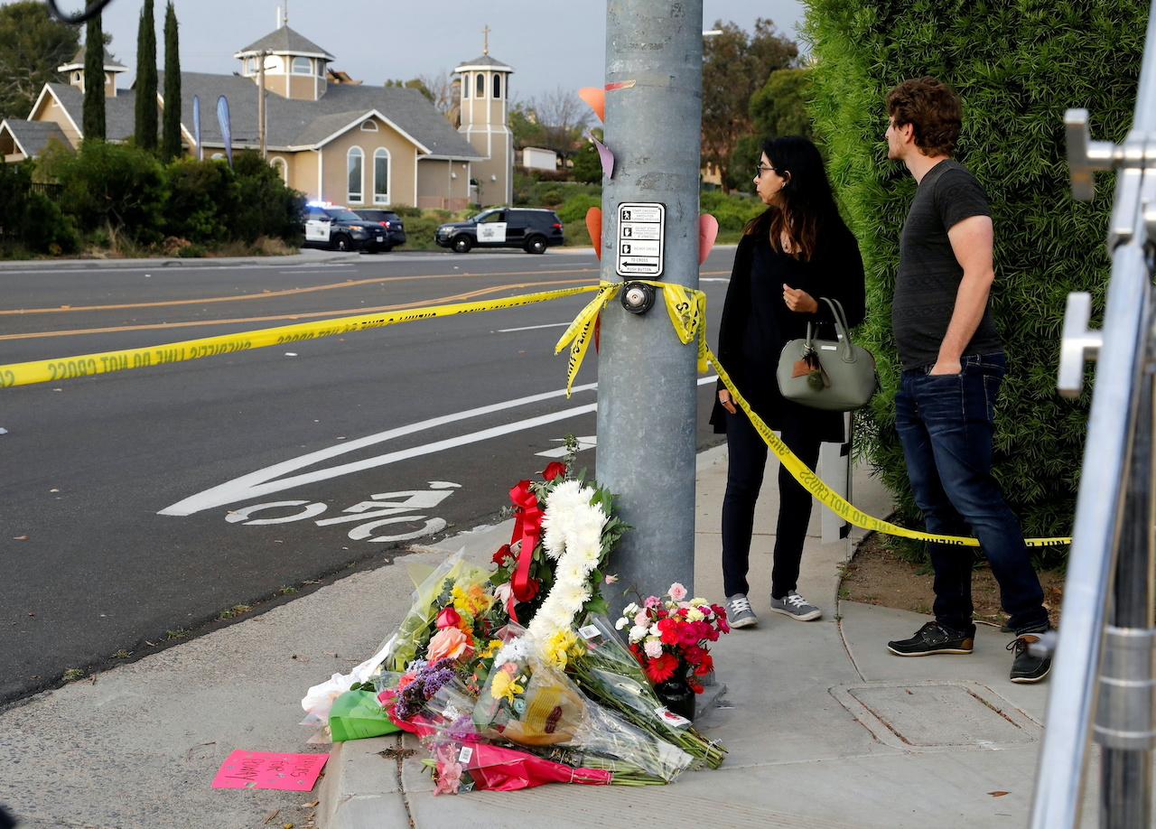 FILE PHOTO: A makeshift memorial is placed by a light pole a block away from a shooting incident where one person was killed at the Congregation Chabad synagogue in Poway