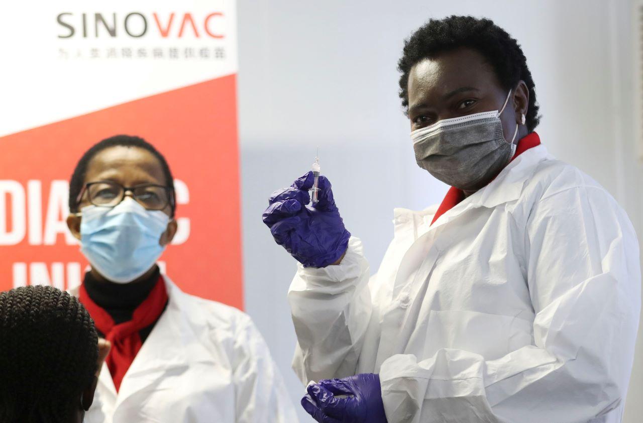 A health worker shows a syringe containing vaccine before administering it during the launch of the South African leg of a global Phase III trial of Sinovac's Covid-19 vaccine in children and adolescents, in Pretoria, South Africa, in this file photo dated Sept 10. Photo: Reuters