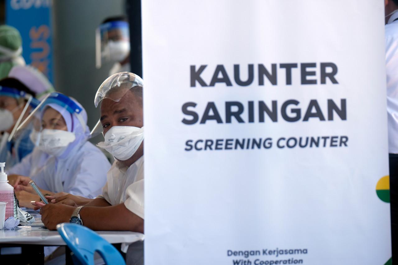 Tourists are screened for Covid-19 at the Kuala Kedah ferry terminal before continuing to Langkawi under the domestic tourism bubble launched on Sept 16. Photo: Bernama