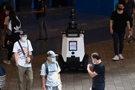 In this file photo taken on Sept 6, an autonomous robot named 'Xavier' patrols a shopping and residential district during a three-week trial by the Home Team Science and Technology Agency in Singapore. Singapore is frequently criticised for curbing civil liberties and people are accustomed to tight controls, but there is still growing unease at intrusive tech.Photo: AFP
