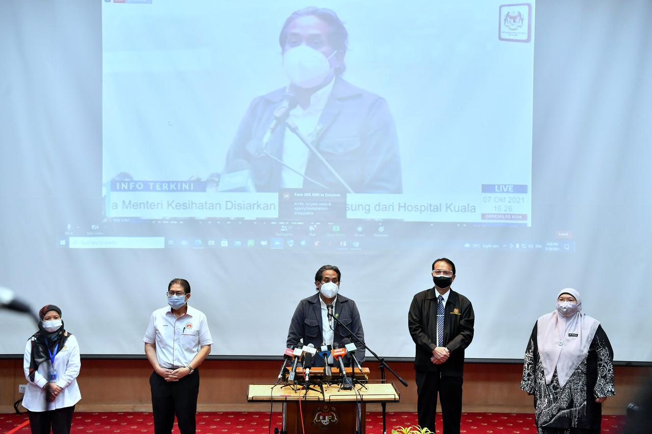 Health Minister Khairy Jamaluddin (centre) speaks at a press conference at Hospital Kuala Lumpur today. With him is health director-general Dr Noor Hisham Abdullah (second right). Photo: Bernama