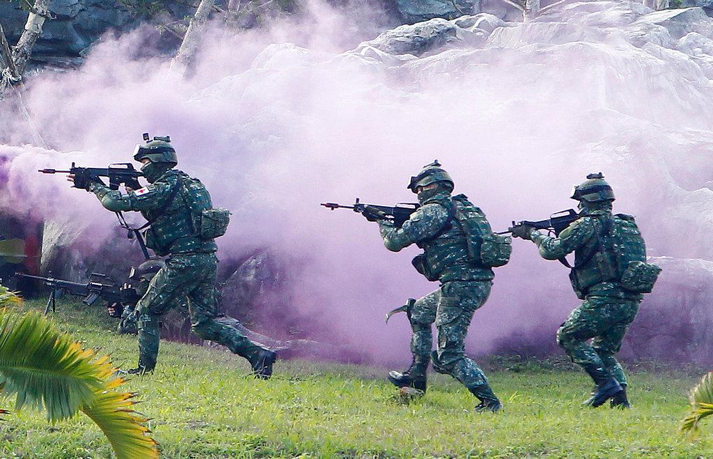 In this Dec 14, 2017, file photo, soldiers from Taiwan's special forces move through coloured smoke during a military exercise in Taipei, Taiwan. Photo: AP