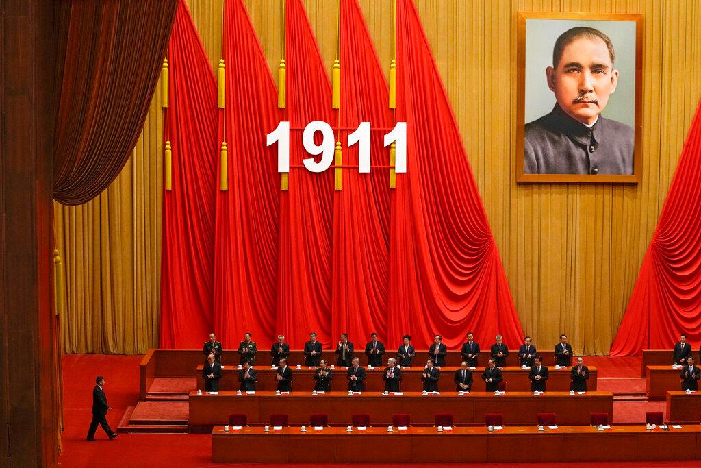 Delegates applaud as Chinese President Xi Jinping (left) arrives at an event commemorating the 110th anniversary of Xinhai Revolution at the Great Hall of the People in Beijing, Oct 9. Photo: AP