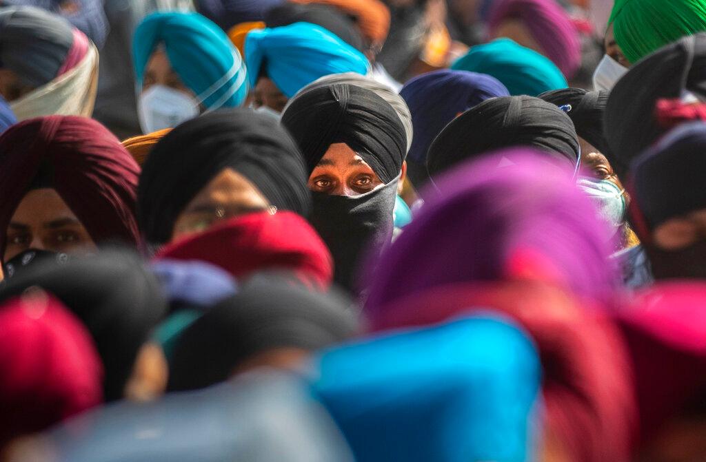 Sikh community members participate in the funeral procession of one of two teachers shot dead by gunmen at a government-run school in Srinagar. Photo: AP