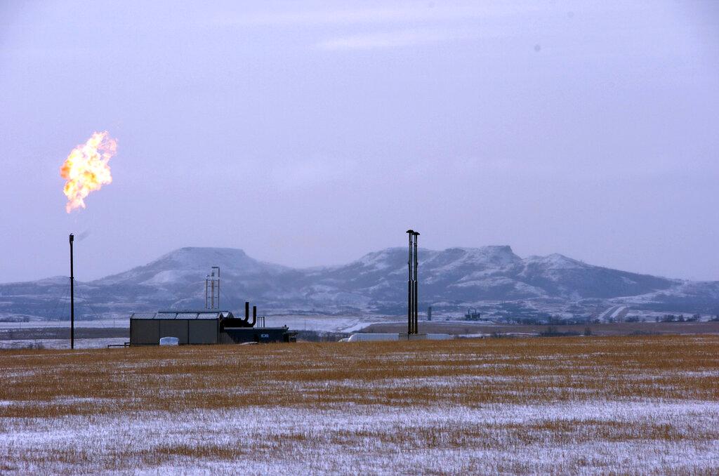 In this Feb. 25, 2015, file photo, a gas flare is seen at a natural gas processing facility near Williston, North Dakota. The US is due to release oil and gas methane regulations in the coming weeks and the European Union will unveil detailed methane legislation later this year. Photo: AP
