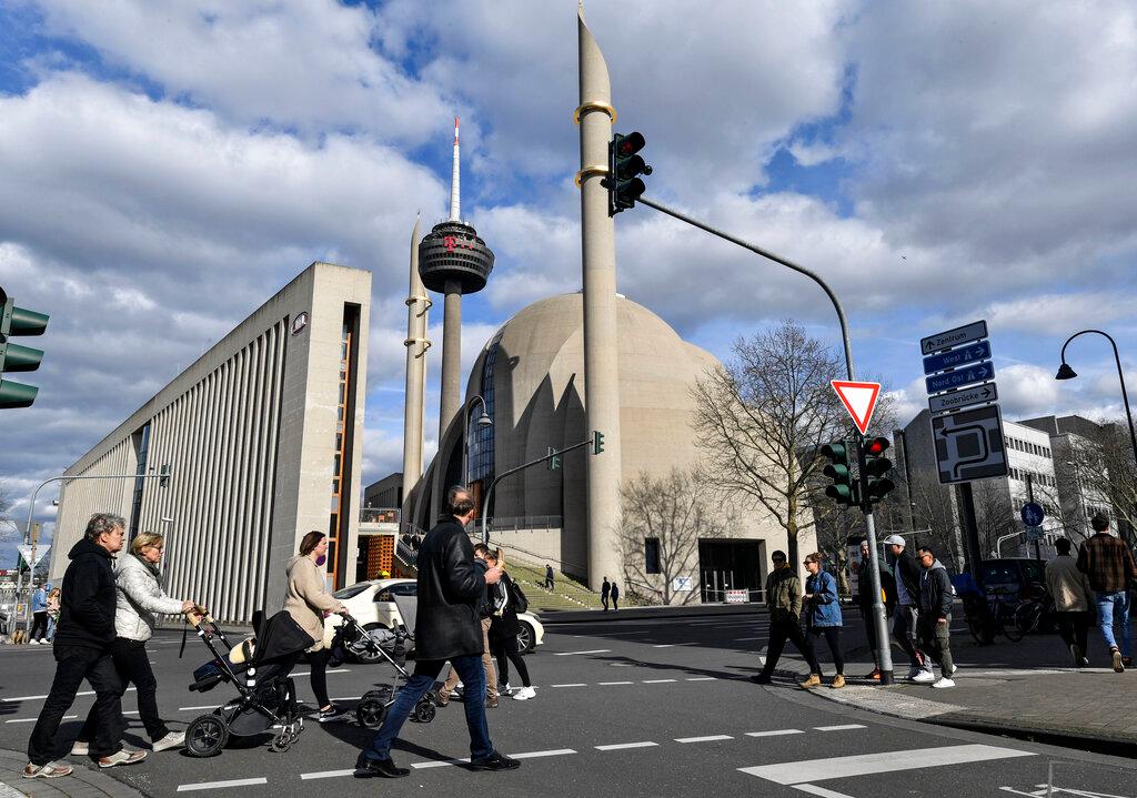 People pass a street in front of the Cologne Central Mosque, Germany, in this March 15, 2020 file photo. Photo: AP