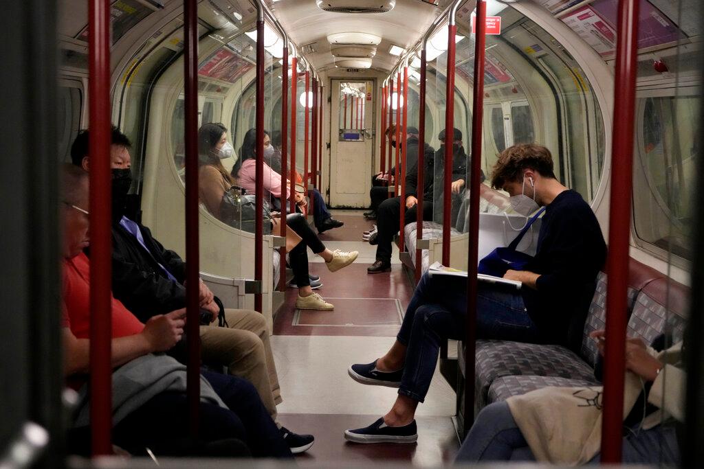 Most of the people travelling in a tube underground train carriage wear face masks to curb the spread of coronavirus on the Bakerloo Line in London, Oct 4. Photo: AP