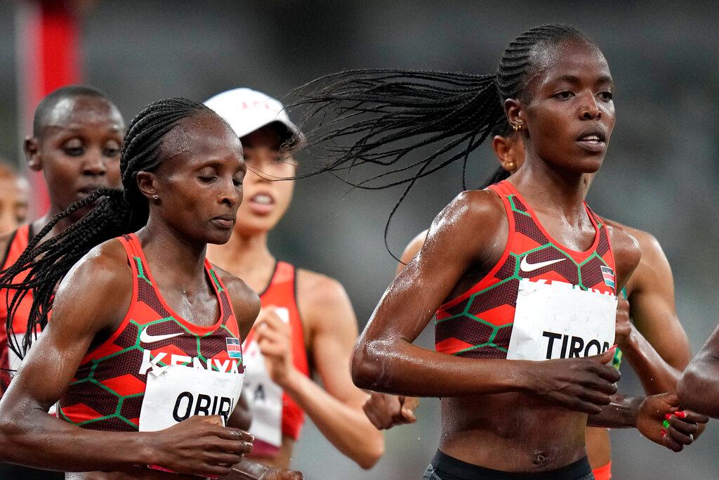 In this Aug 2 file photo, Kenya's Agnes Tirop (right) competes in the women's 5,000m final at the 2020 Summer Olympics in Tokyo. Photo: AP
