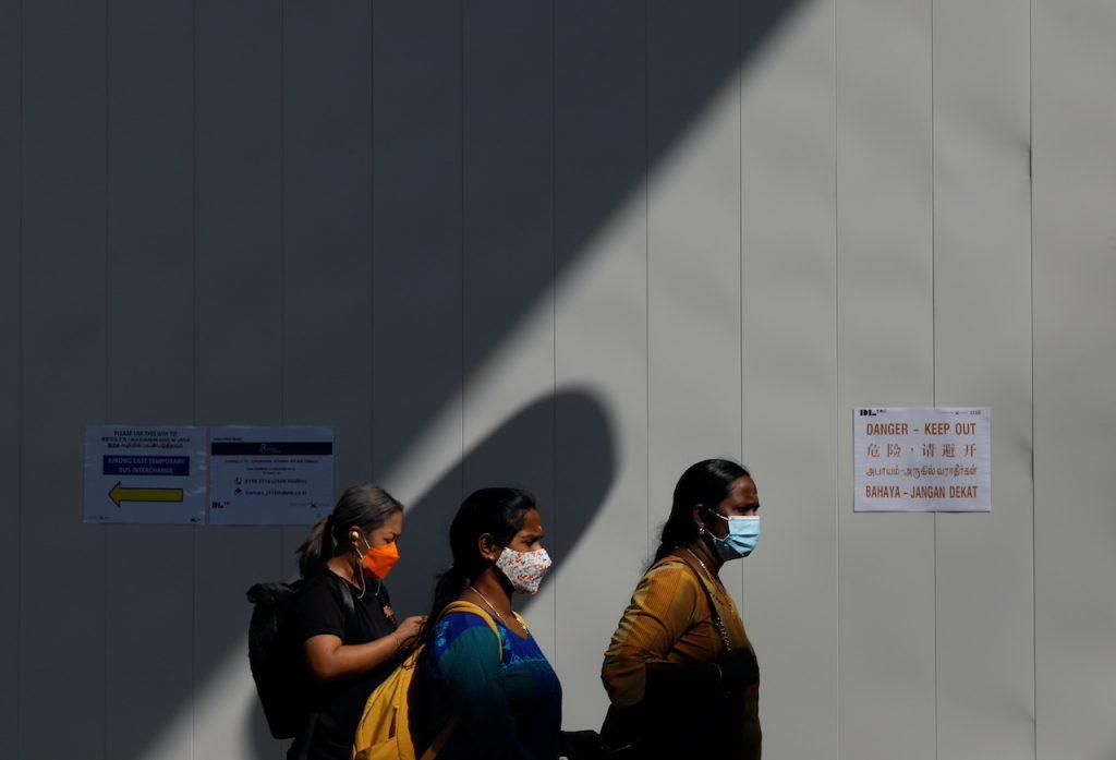 Commuters leave a train station during the Covid-19 outbreak in Singapore, Sept 23. Photo: Reuters