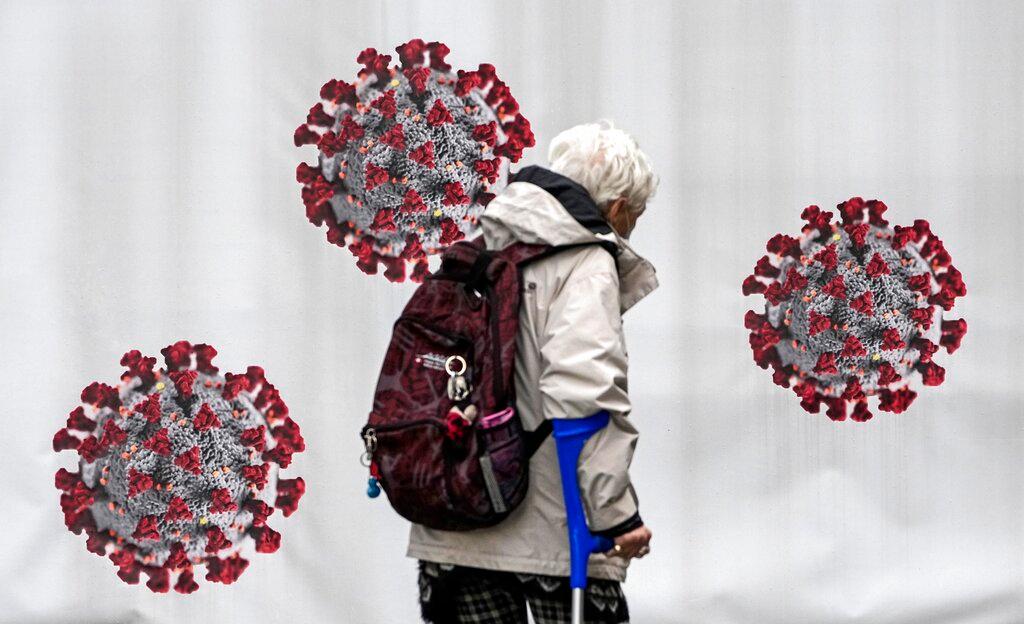 A woman passes a coronavirus test centre in Duisburg, Germany, Oct 12. Photo: AP