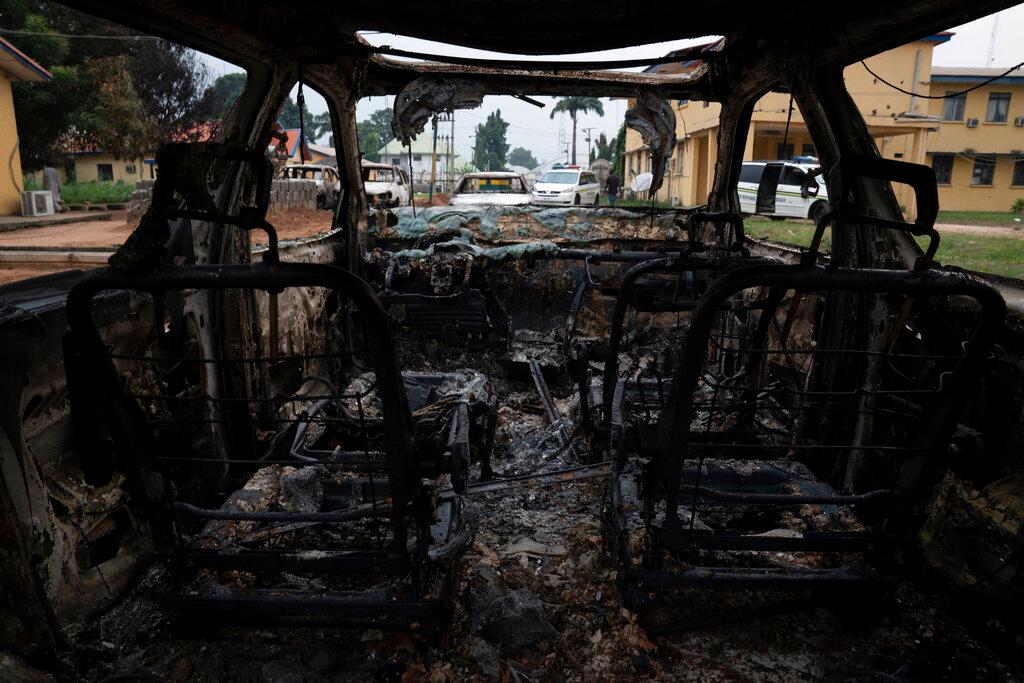 A burned vehicle is parked outside the police command headquarters in Owerri, Nigeria, April 5. Nigeria is struggling with security problems across its vast territory, and has seen several major attacks on its  prisons this year. Photo: AP