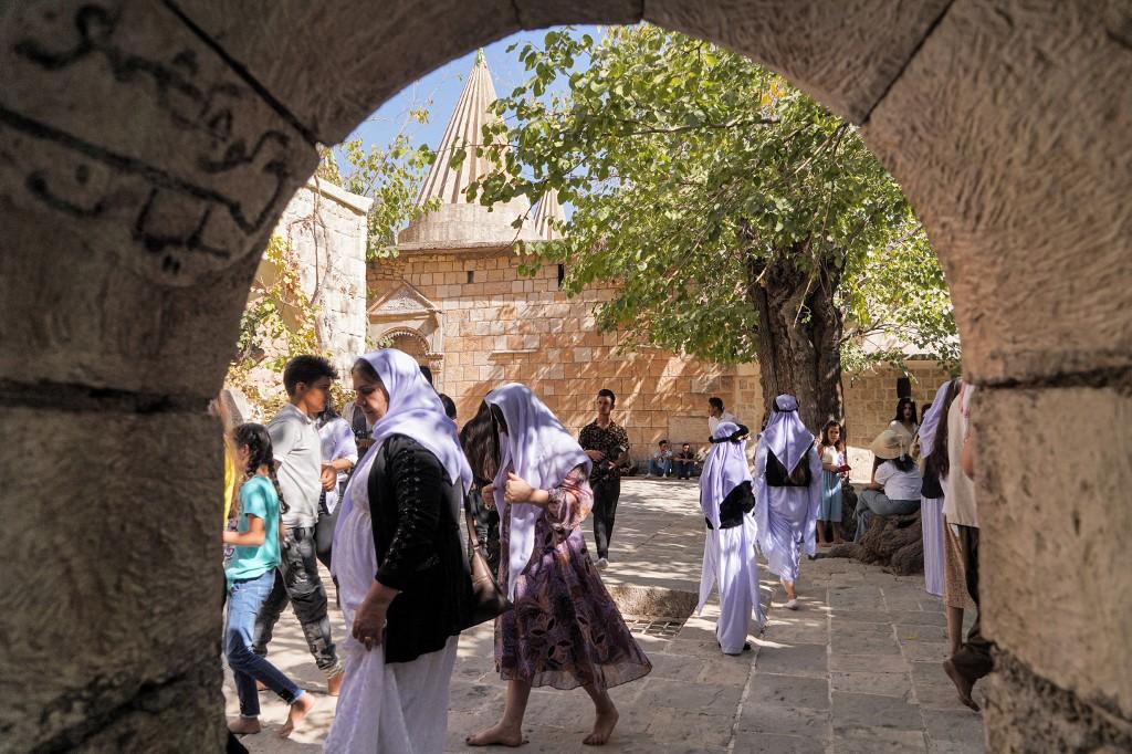 People visit the Yazidi Temple of Lalish, the holiest temple of the faith, in the Lalish valley near the Iraqi Kurdish city of Dohuk, on Oct 7. A Kurdish-speaking group hailing from northern Iraq, the Yazidis were specifically targeted and oppressed by the jihadists beginning in 2015. Photo: AFP