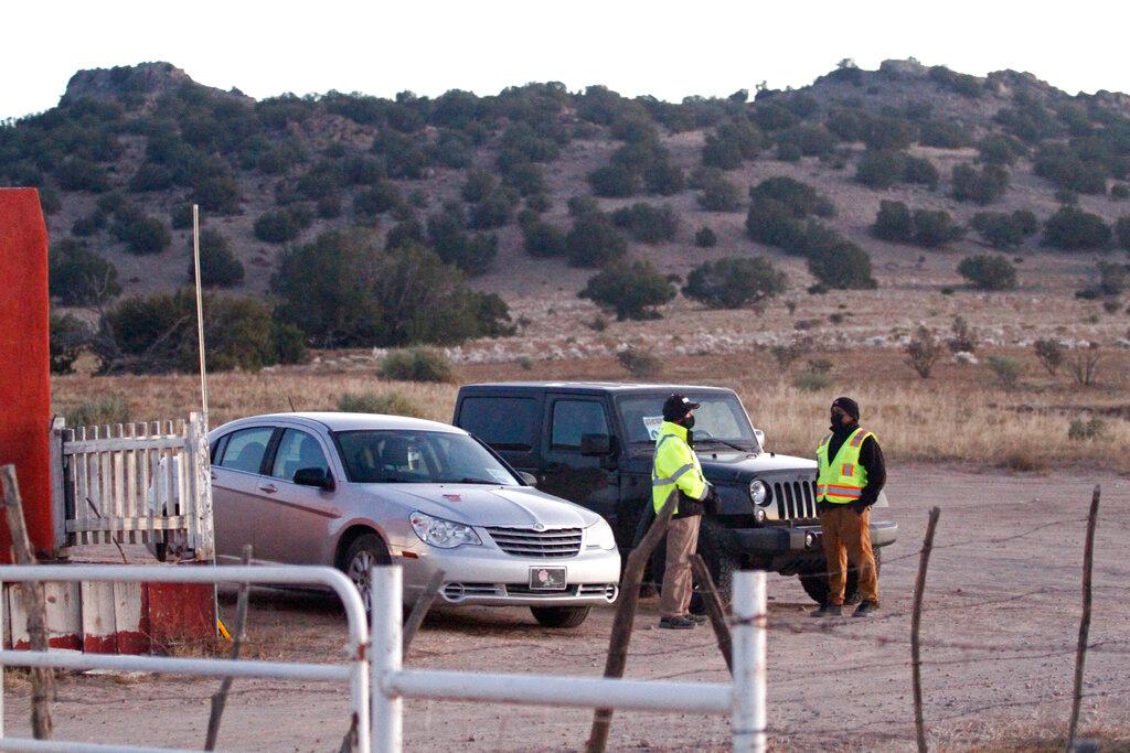Security personnel stand at the entrance to a film set where police say actor Alec Baldwin fired a prop gun, killing a cinematographer, outside Santa Fe, New Mexico, Oct 22. Photo: AP
