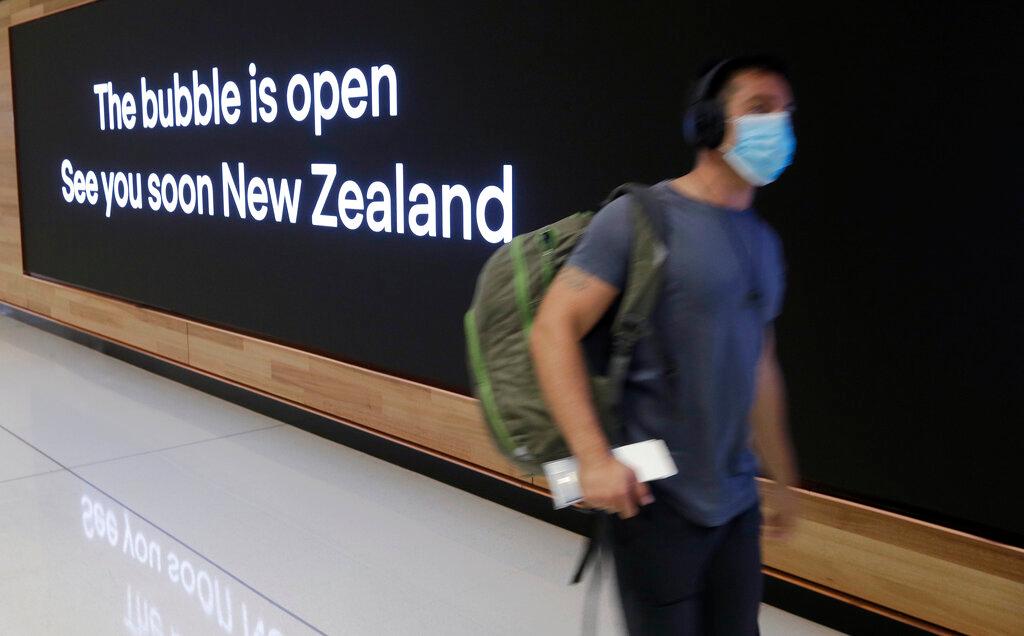 In this April 19 file photo, a passenger travels through Sydney Airport, in Sydney, Australia. Australians have been unable to travel abroad for more than 18 months without a government waive. Photo: AP