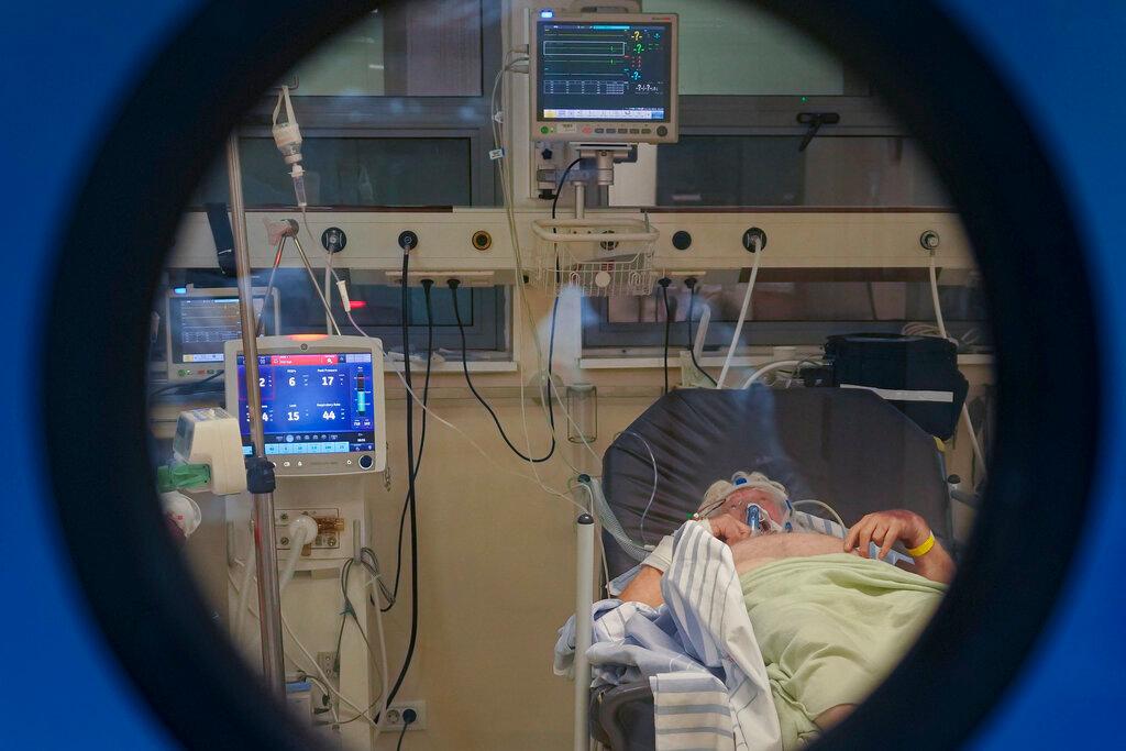 A person lies on a bed in a Covid-19 isolation room at the University Emergency Hospital in Bucharest, Romania, Oct 22. In Romania, a European Union country of around 19 million, only 35% of adults are fully inoculated against Covid-19 compared to an EU average of 74%. Photo: AP