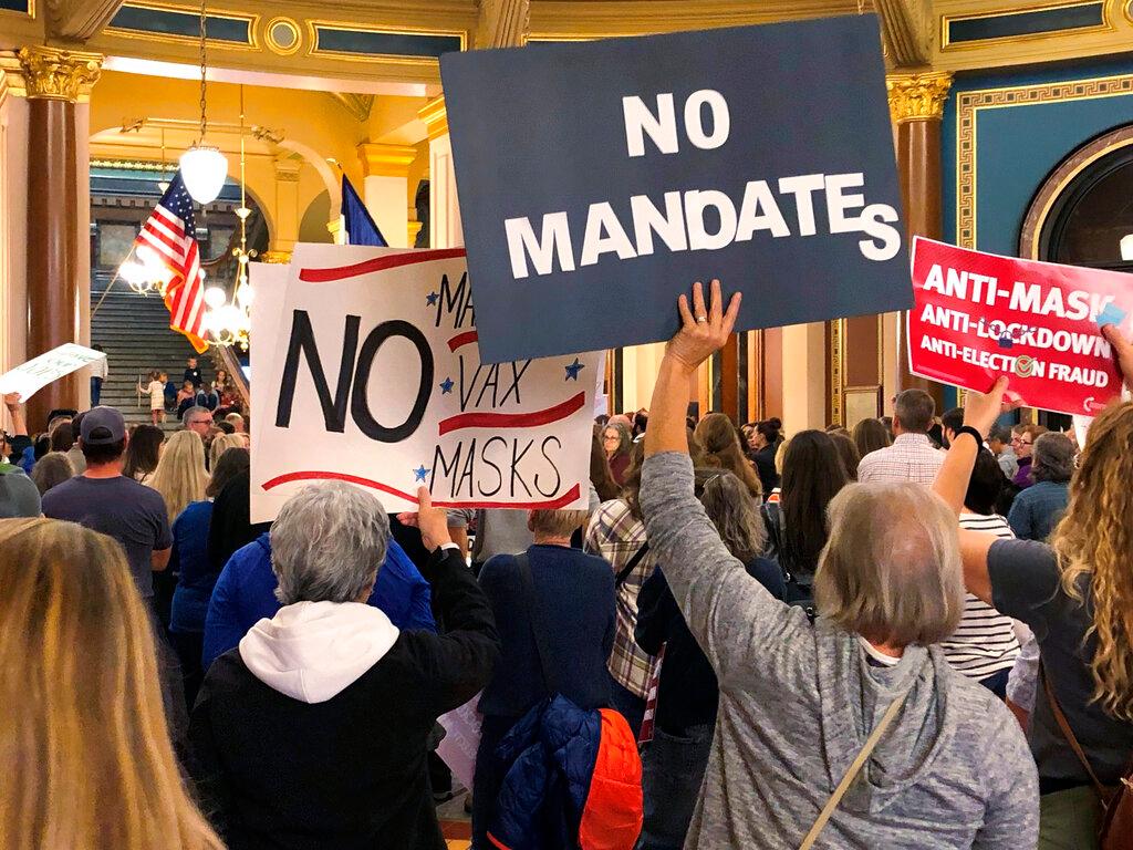 Protesters gather at the Iowa Capitol in Des Moines, Iowa, on Oct 28, to push the Iowa legislature to pass a bill that would prohibit vaccine mandates from being imposed on employees in the state. Photo: AP