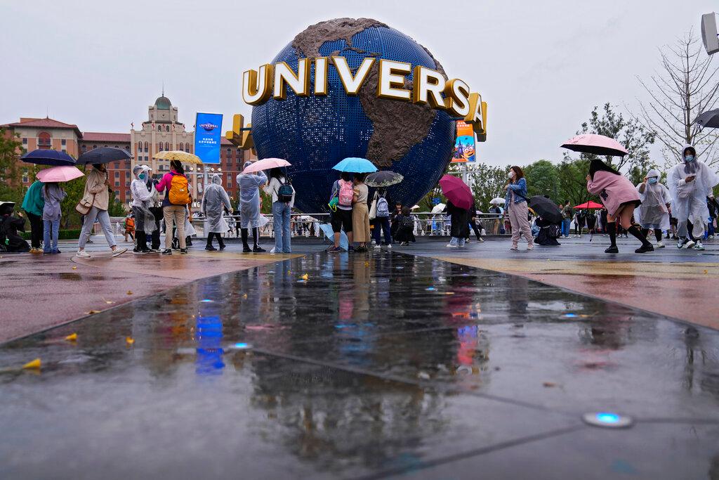 People gather and take selfies in a plaza near the entrance of the Universal Studios Beijing in Beijing, Sept 20. Photo: AP