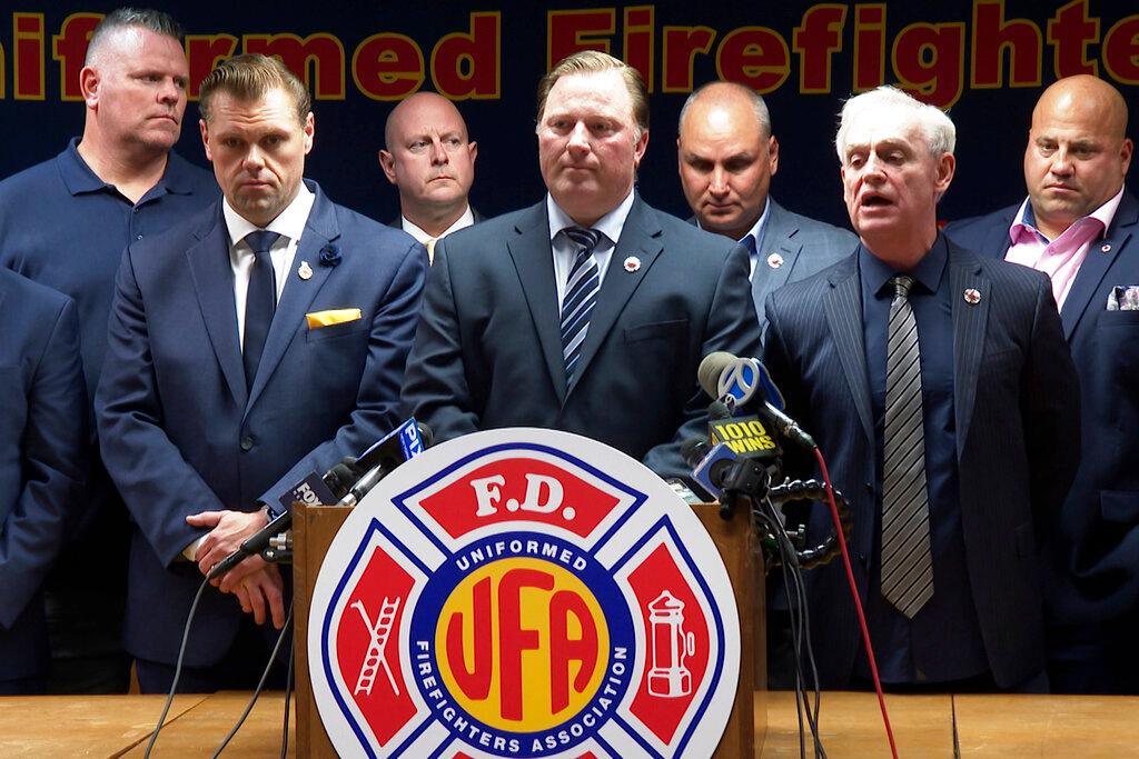The FDNY- Uniformed Firefighters Association speak at a news conference in New York City in regards to the opposition of a mandatory Covid-19 vaccine for firefighters, Oct 20. Photo: AP