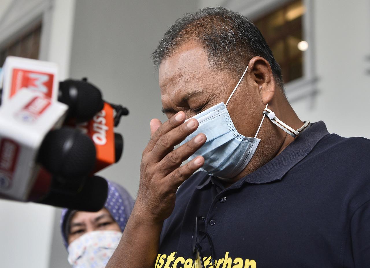 Zulfarhan Osman Zulkarnain's father, Zulkarnain Idris, reacts upon leaving the High Court in Kuala Lumpur after the judge's sentence on the six National Defence University of Malaysia students convicted of culpable homicide in his son's death four years ago. Photo: Bernama