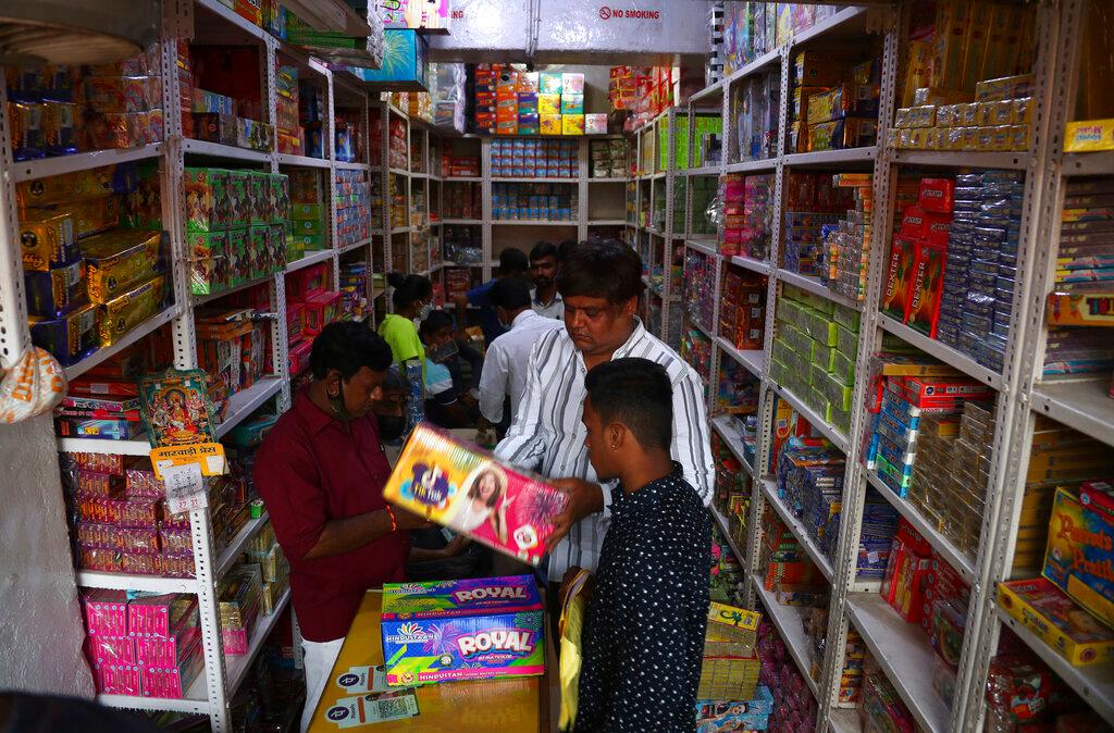 People buy firecrackers ahead of Deepavali festival in Hyderabad, India, Oct 30. Diwali, the Hindu festival of lights, will be celebrated on Nov 4. Photo: AP