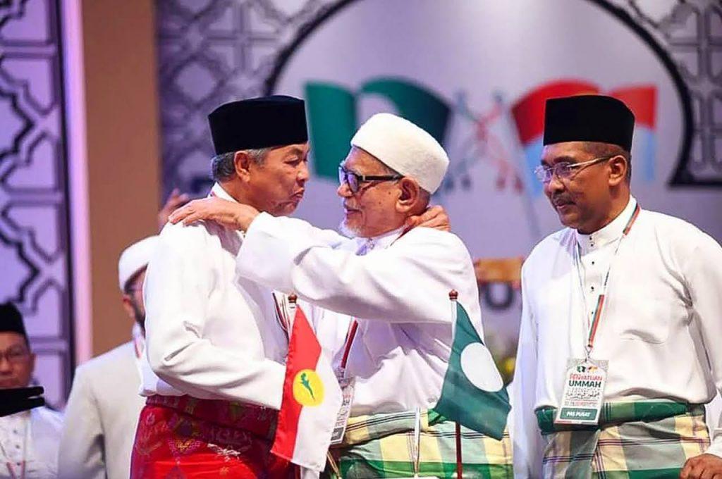 Umno president Ahmad Zahid Hamidi with PAS president Abdul Hadi Awang at the signing of the Muafakat Nasional charter of cooperation on Sept 14 last year.