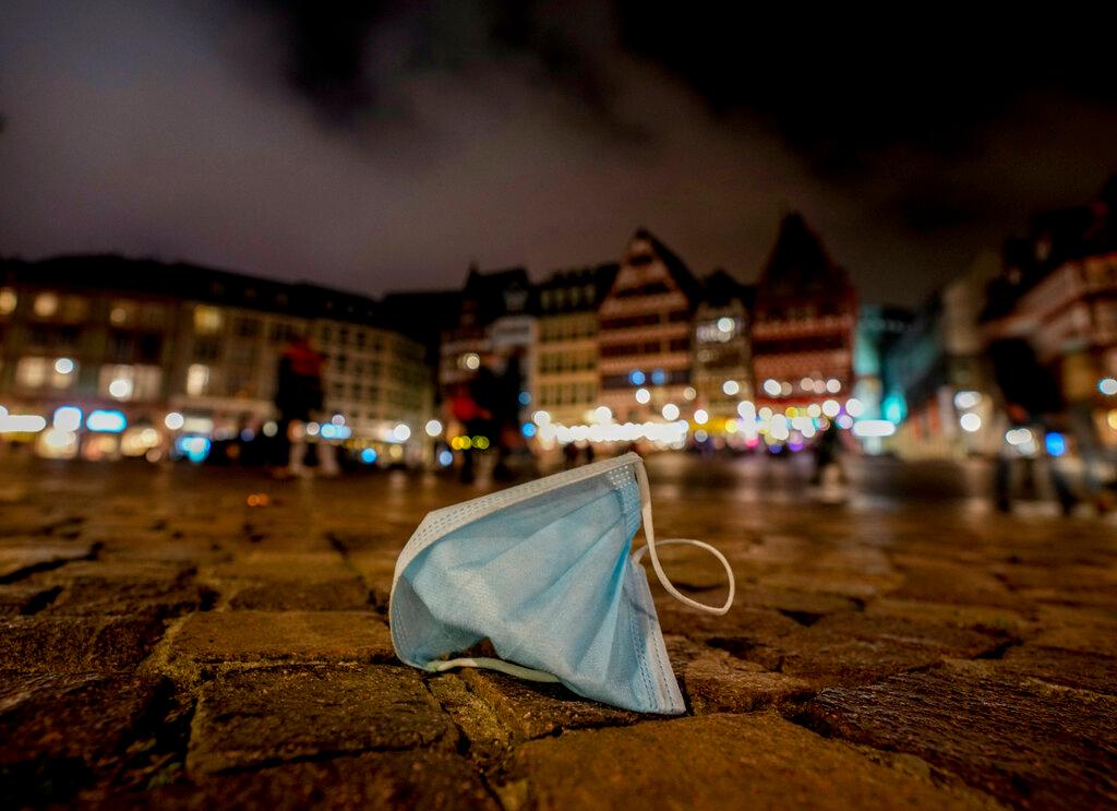 A face mask left on Roemerberg square in Frankfurt, Nov 6. The surge in German cases comes with the country in political limbo following September's general election. Photo: AP