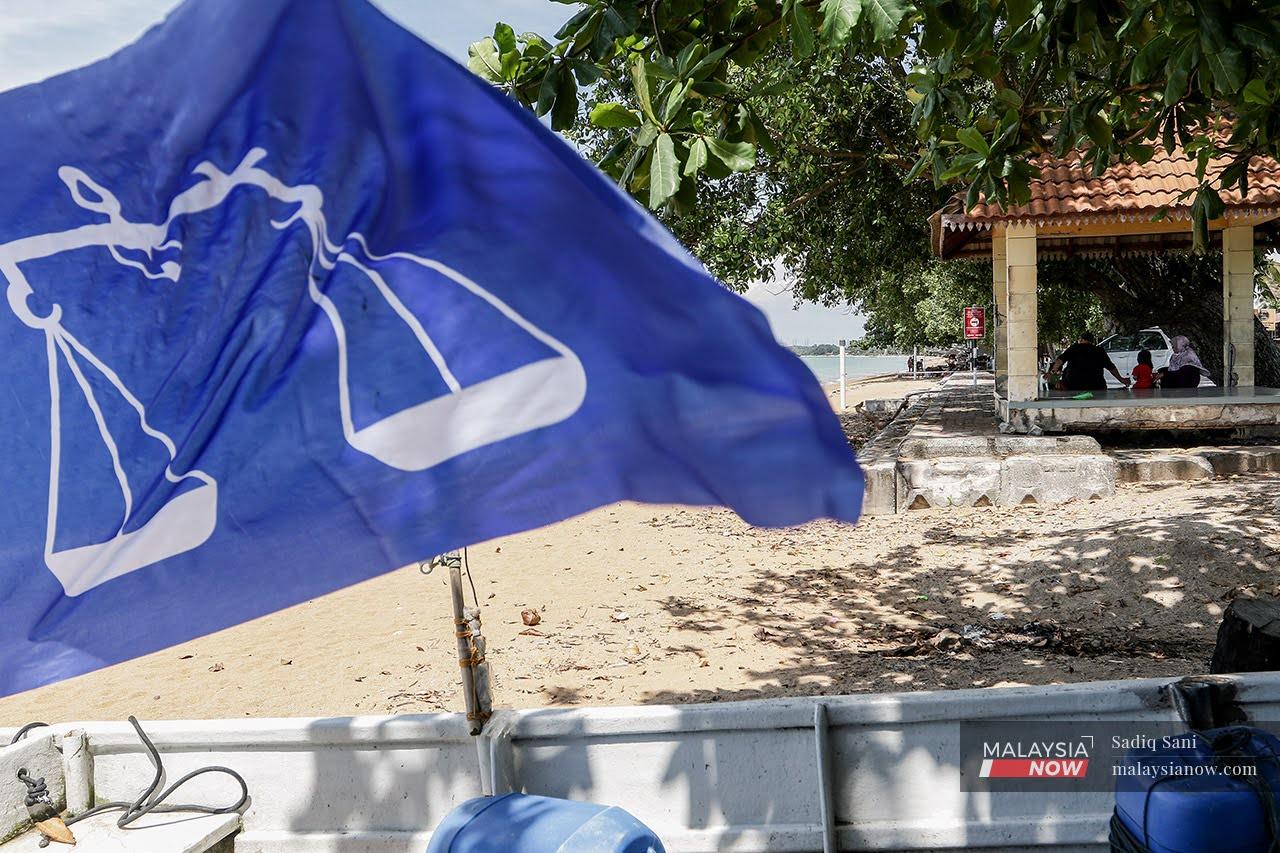 A Barisan Nasional flag flutters on a beach in Melaka as campaigning begins for the state election on Nov 20.