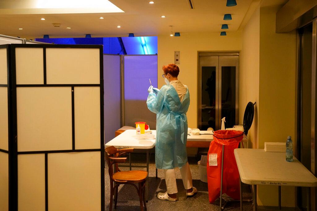 A healthcare worker prepares Johnson & Johnson's Janssen Covid-19 vaccine at a vaccination centre inside the National Theater in Prague, Czech Republic, Nov 11. Photo: AP