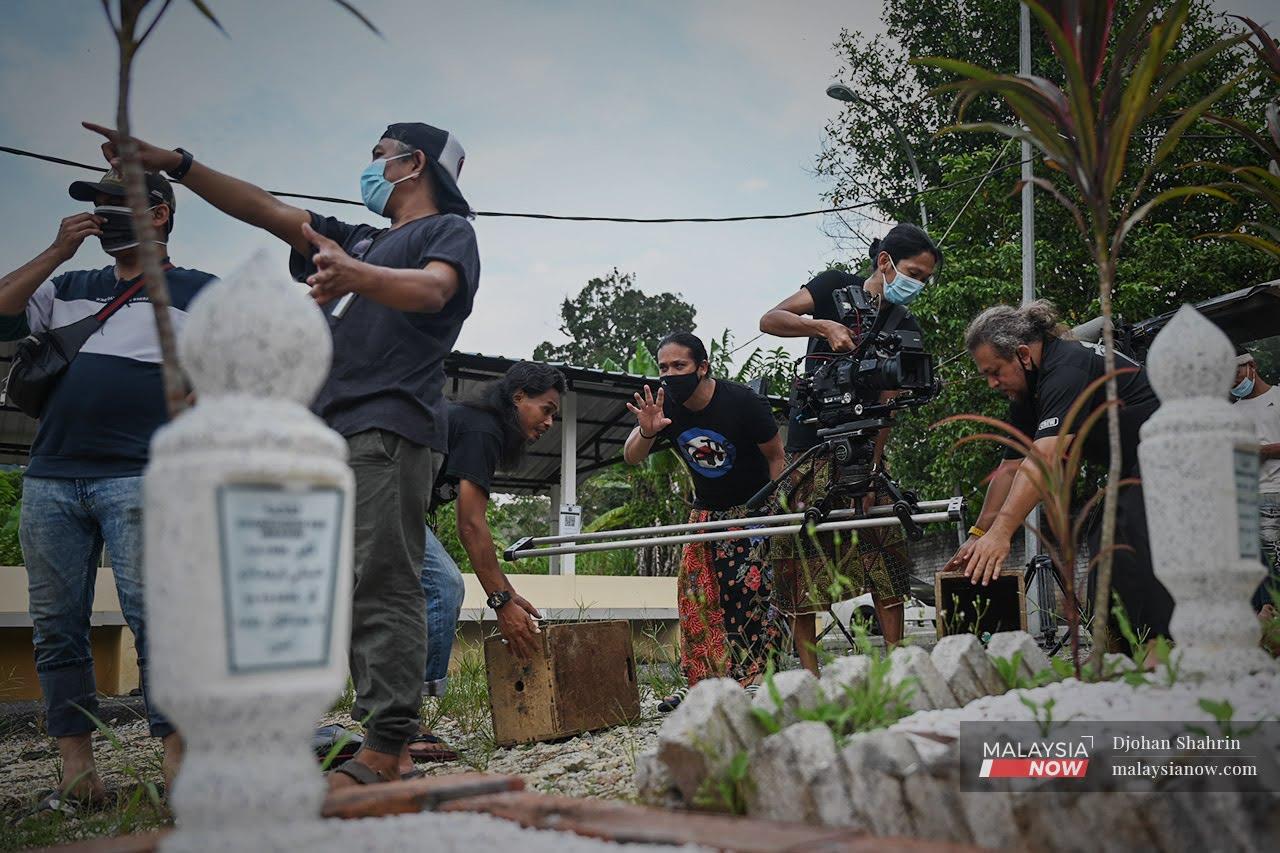A film crew prepares to shoot a scene at a site in Hulu Langat, Selangor, in this file picture taken after the government lifted restrictions on the creative industry last month.