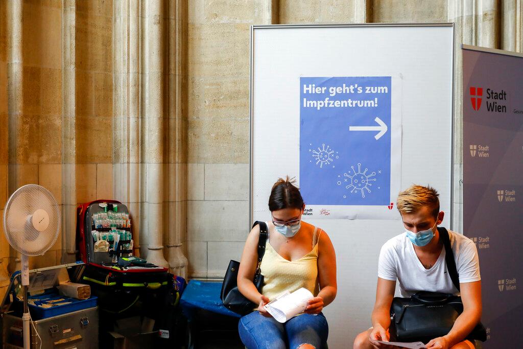 People wait to be vaccinated against Covid-19 at the St Stephan's Cathedral in Vienna, Austria, Aug 13. Photo: AP