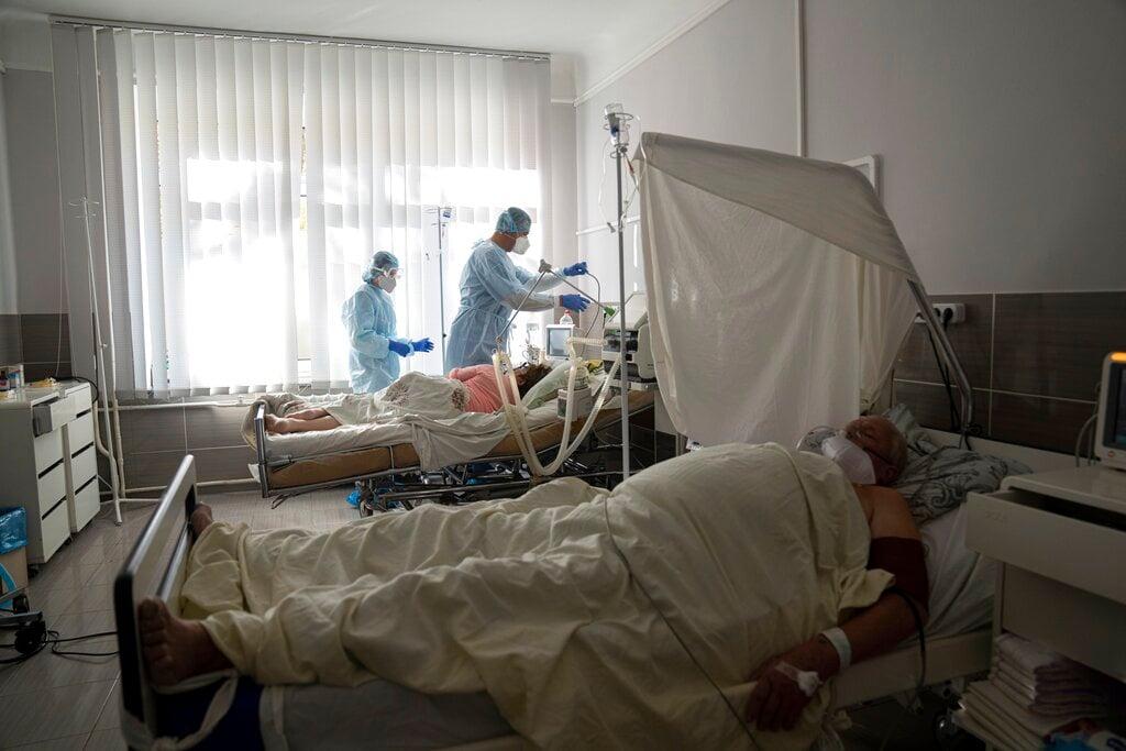 Medical staff treat a Covid-19 patient at the ICU of a city hospital in Rivne, 300km west of Kiev in Ukraine. Photo: AP