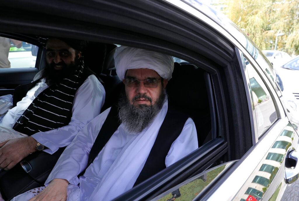 The Taliban delegation led by Amir Khan Muttaqi, the acting foreign minister, rear, sit in a car at Esenboga Airport, in Ankara, Turkey, Oct 14. Concerned nations have pledged hundreds of millions of dollars in aid, but are reluctant to commit funds unless the Taliban agree to a more inclusive government and to guarantee the rights of women and minorities. Photo: AP