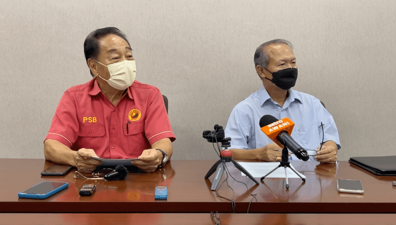 Former bishop Bolly Lapok (right) speaks at a press conference with Parti Sarawak Bersatu president Wong Soon Koh.