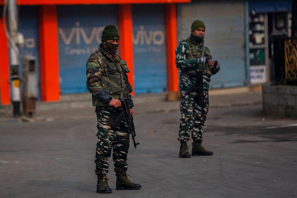 Indian paramilitary soldiers stand guard outside a paramilitary post during a strike called by separatist leaders against the killing of civilians in Srinagar, Indian controlled Kashmir, Nov 19. Photo: AP