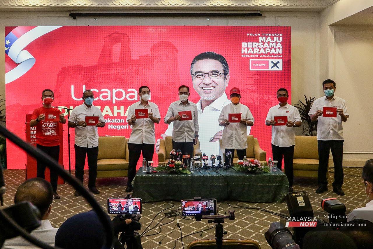 Pakatan Harapan chairman Anwar Ibrahim (centre) with other coalition leaders including DAP's Lim Guan Eng at the launch of its action plan for the Melaka state election on Nov 10.