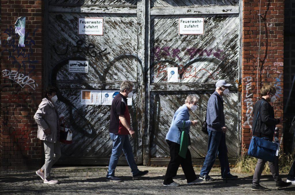 People line up in front of a vaccination centre at the Arena Treptow in Berlin, Germany, March 31. Case numbers in Germany have been soaring, especially among the elderly whose first two shots of Covid-19 vaccine were at the start of the year, and among children who are not eligible for inoculation. Photo: AP
