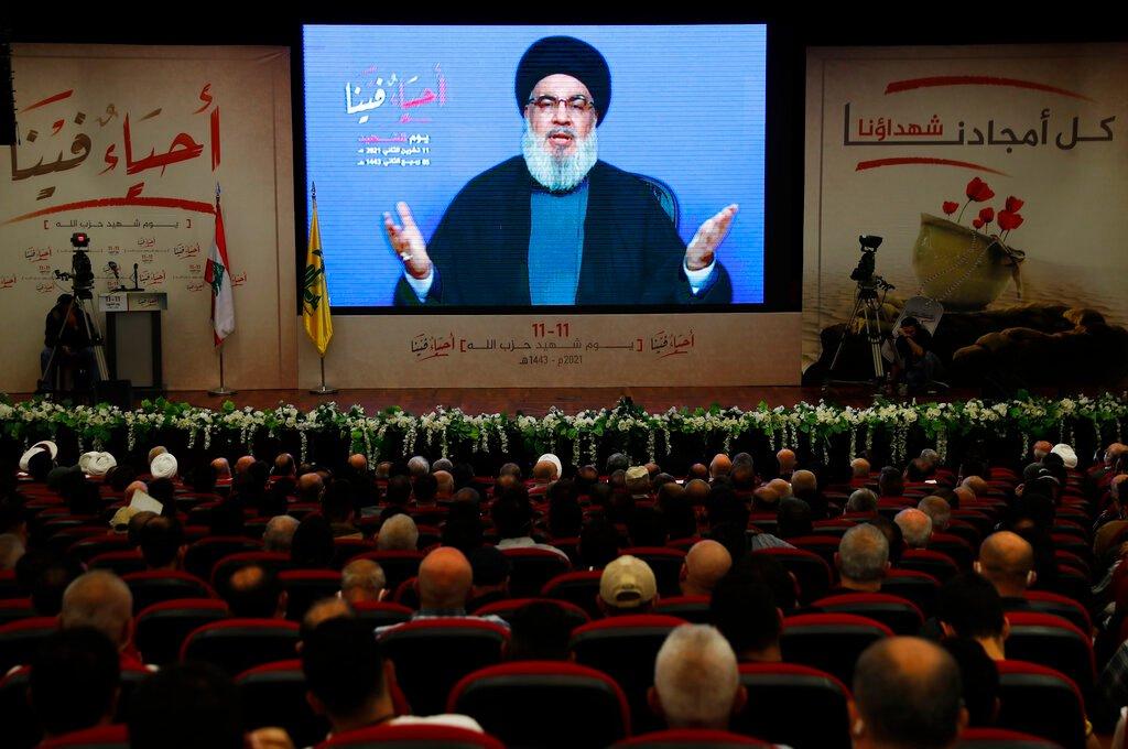 Hezbollah leader Sayyed Hassan Nasrallah, speaks via a video link, during a rally marking Hezbollah Martyr's Day, in the southern suburb of Beirut, Lebanon, Nov 11. Photo: AP