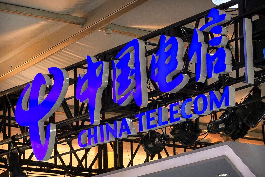 In this Sept 5, 2020, file photo, the logo for Chinese telecommunications firm China Telecom is seen on a booth at the China International Fair for Trade in Services in Beijing. Photo: AP